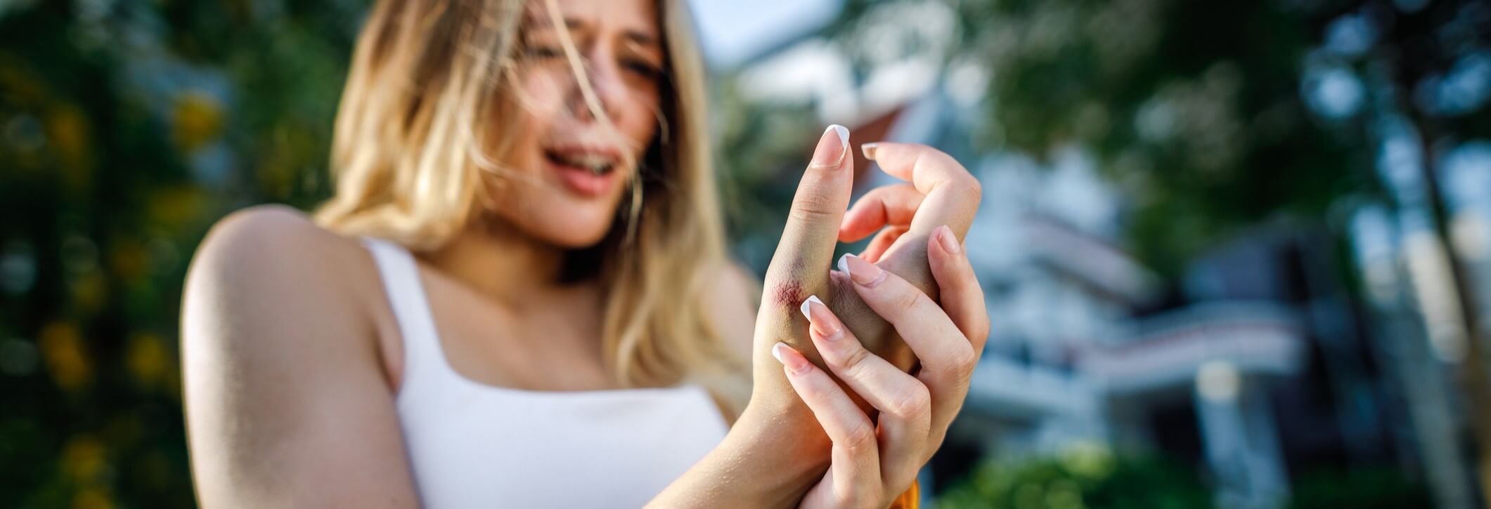 Woman suffering from de quervain's tenosynovitis