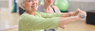 Two women doing hand exercise