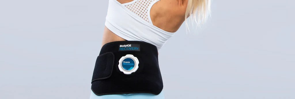 Woman wearing an ice compression device to relieve pain