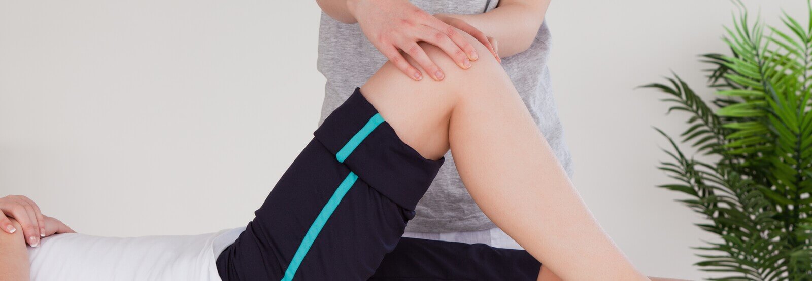 woman getting her knee checked for hyper extended knee