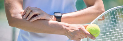 A woman with elbow pain while playing tennis